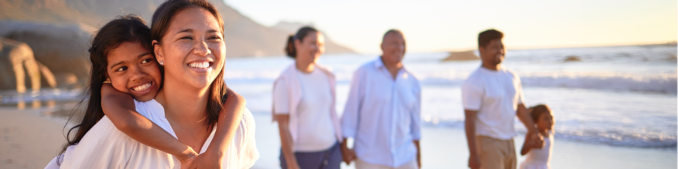 family walking on the beach