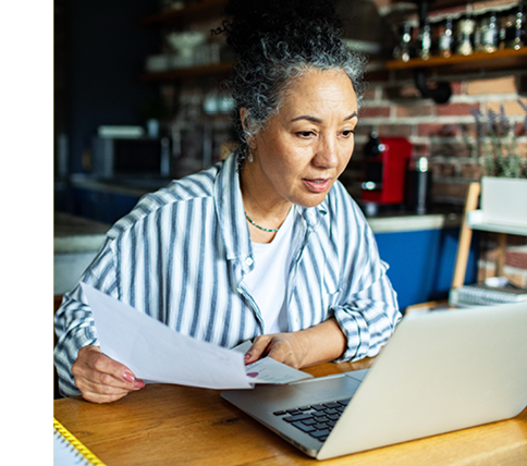 Woman reviewing finances on laptop