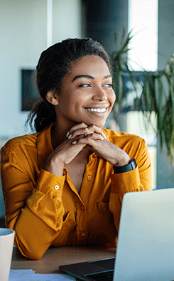 smiling business woman at desk