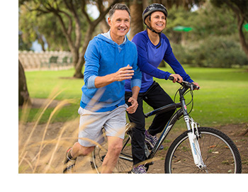 adult couple riding bikes