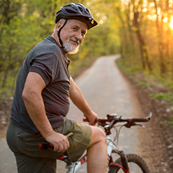 senior male riding a bike